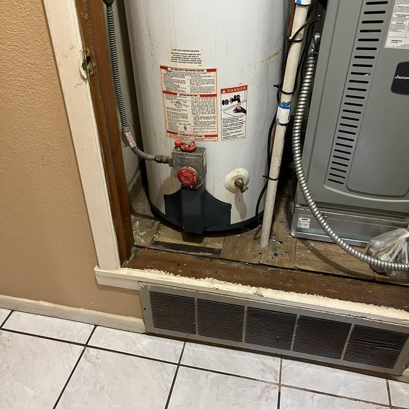 Water heater with piping and gas valve in closet