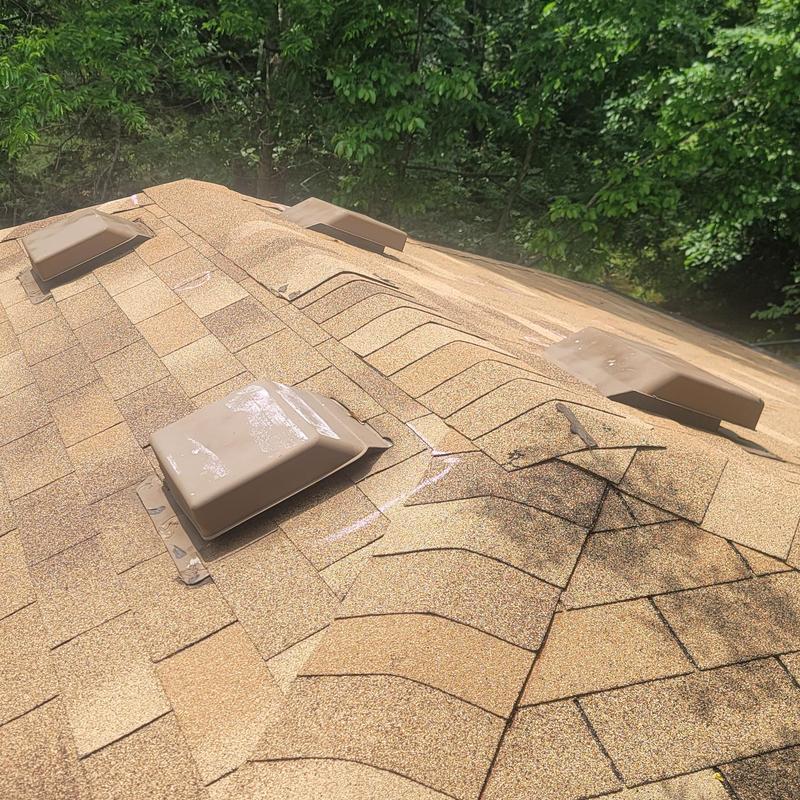 Asphalt shingle roof with hail damage and chalk markings