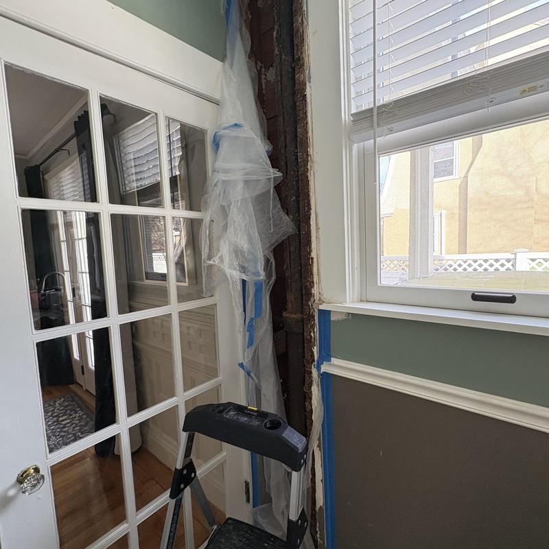 Cast-iron pipe replacement with new PVC in wall cavity