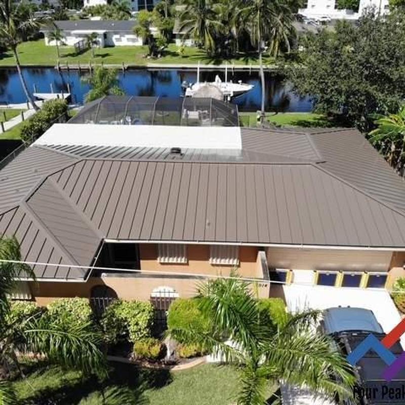 Standing seam metal roof with Polyglass flat roof