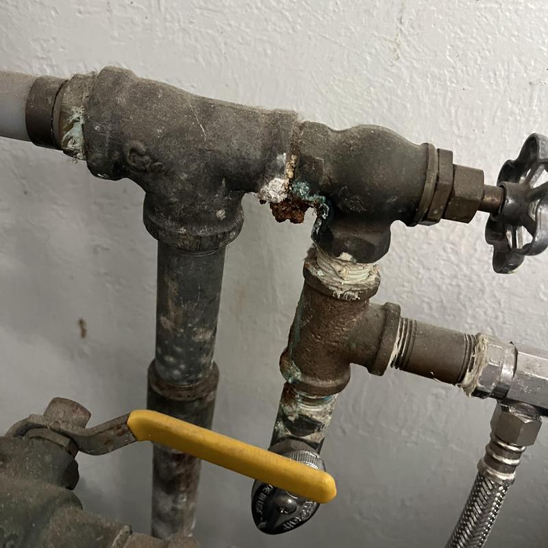 Galvanized water pipes with corrosion and valves