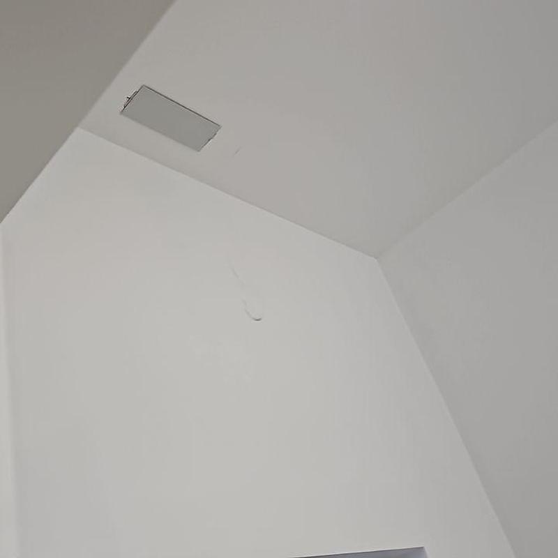 Interior ceiling with water damage stain and cracks Interior ceiling with water damage stain and cracks