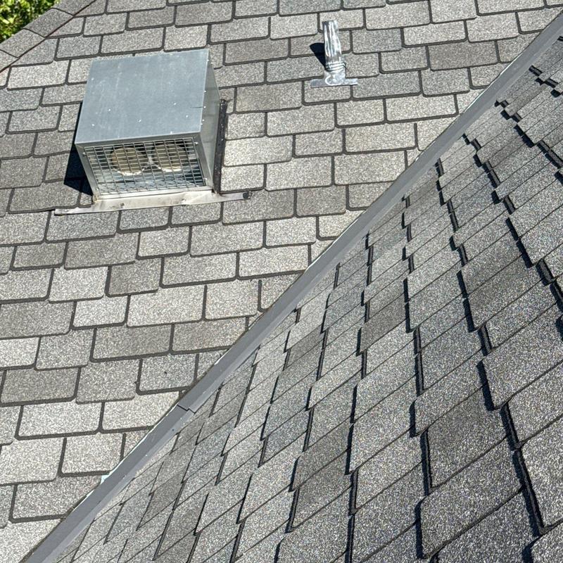 Roof flashing and ventilation system on asphalt shingle roof