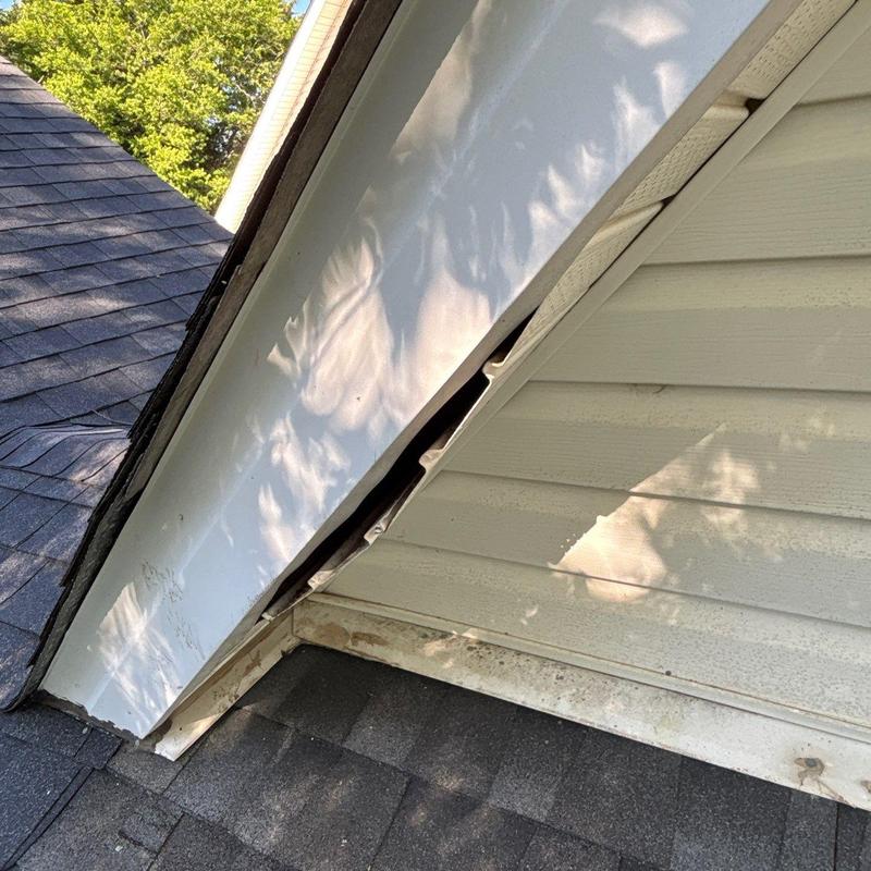 Roof flashing and siding with visible damage