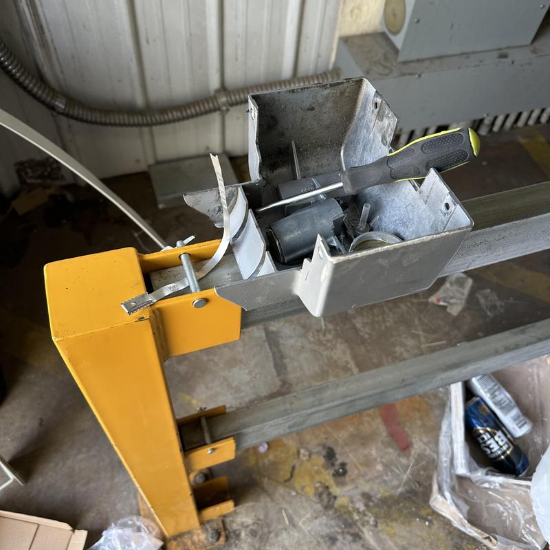 Garage door lock cylinder with screwdriver inside