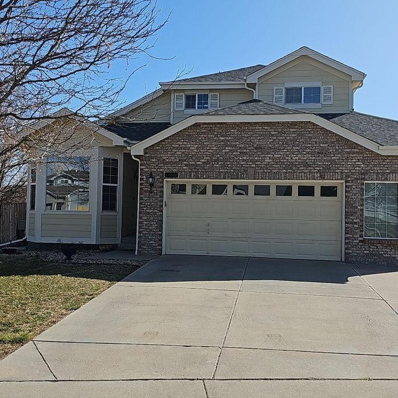 Shingle roof with partial wind damage on residential home Shingle roof with partial wind damage on residential home
