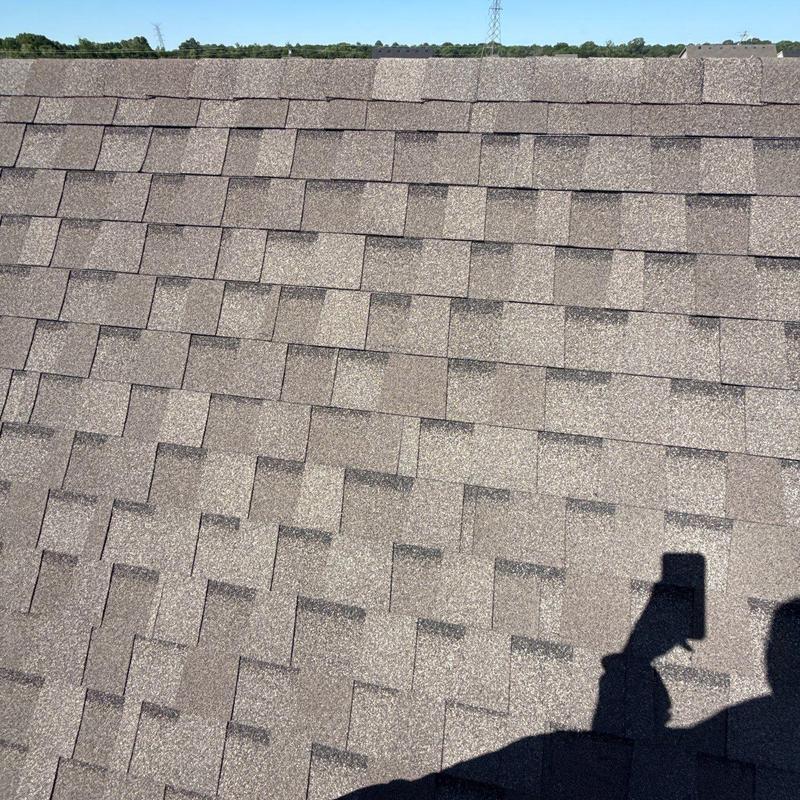 Asphalt shingle roof with hail damage inspection