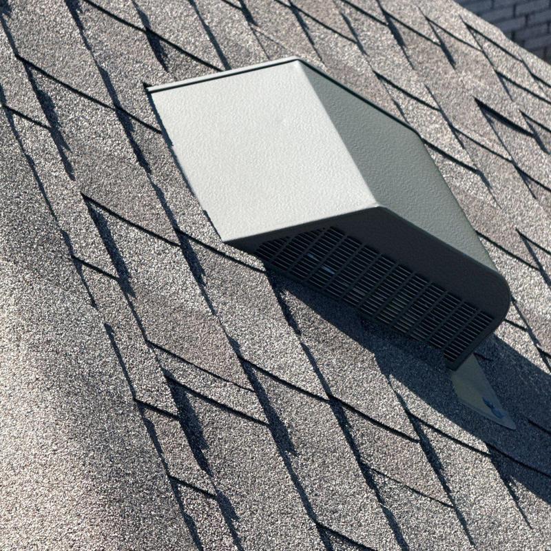 Roof vent and asphalt shingles with hail damage