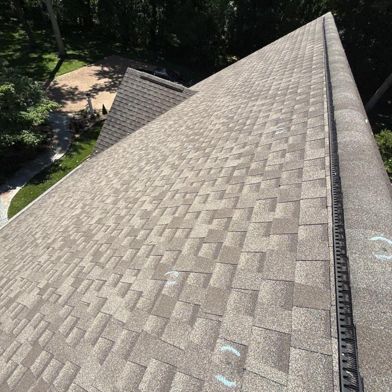 Asphalt shingle roof with hail damage markings