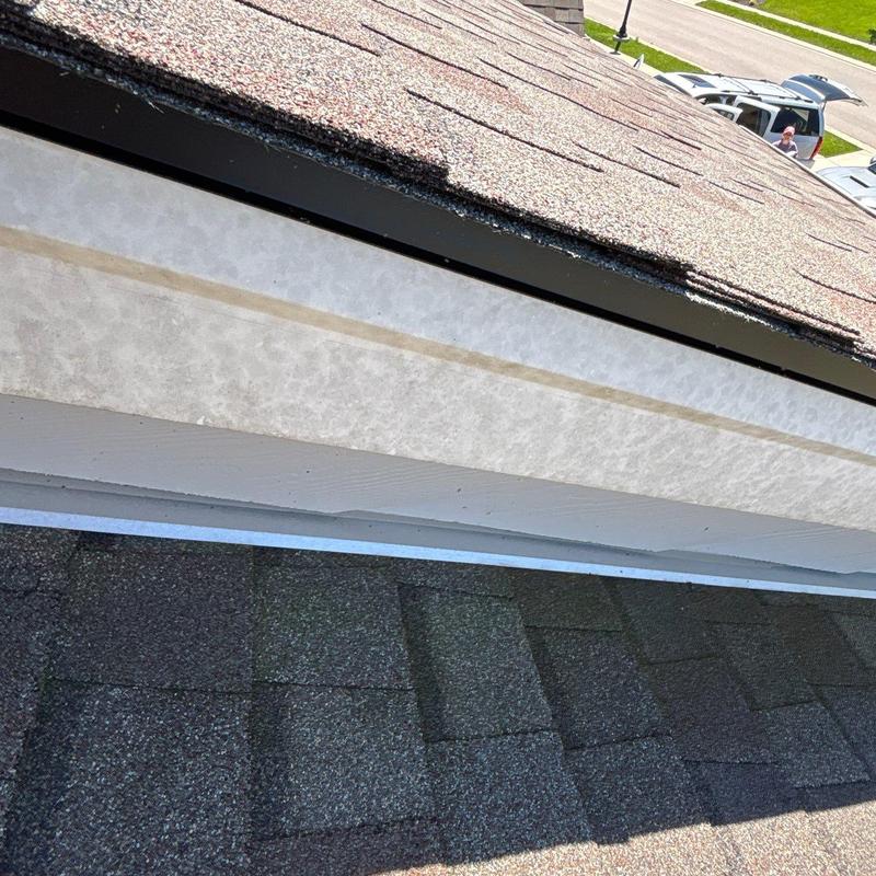 Asphalt shingle roof with hail damage inspection