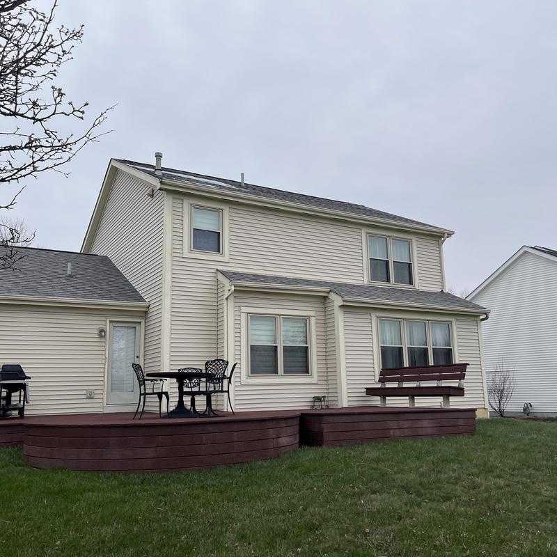 Roof shingles on two-story home exterior Roof shingles on two-story home exterior