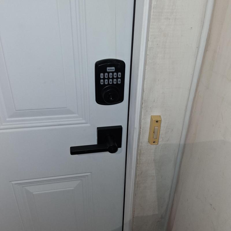 Smart key electronic door lock on white door