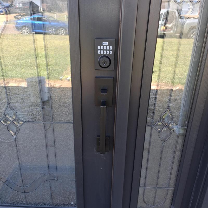 Smart keypad lock set on front door handle
