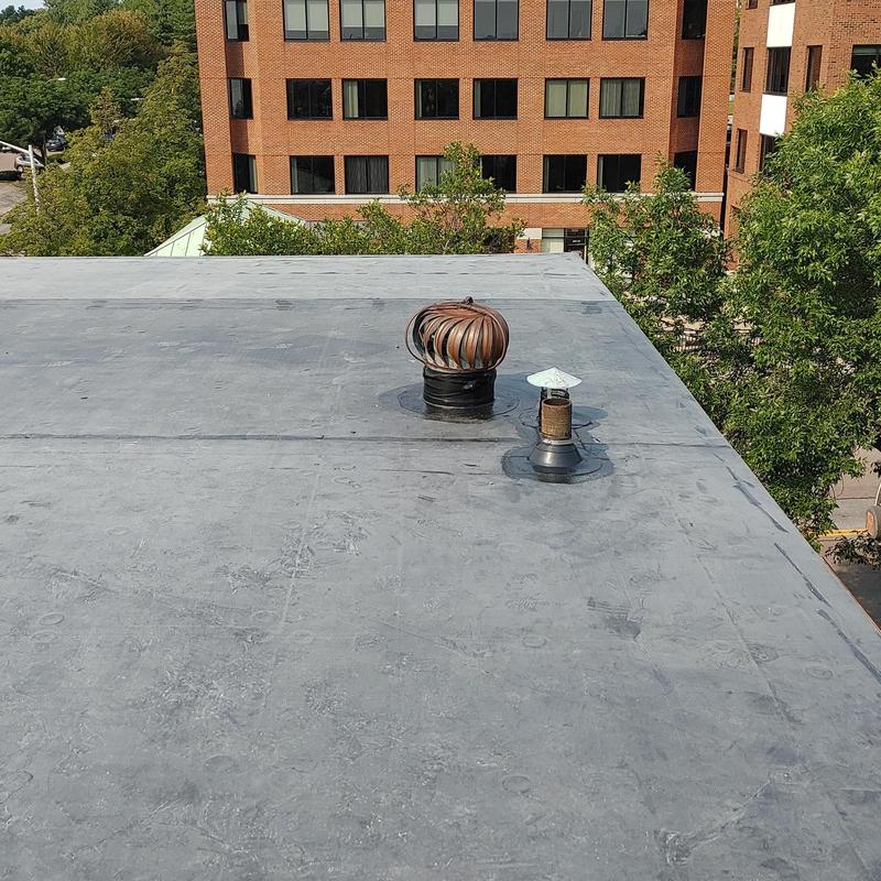 EPDM flat roof with ventilation turbines and vents EPDM flat roof with ventilation turbines and vents