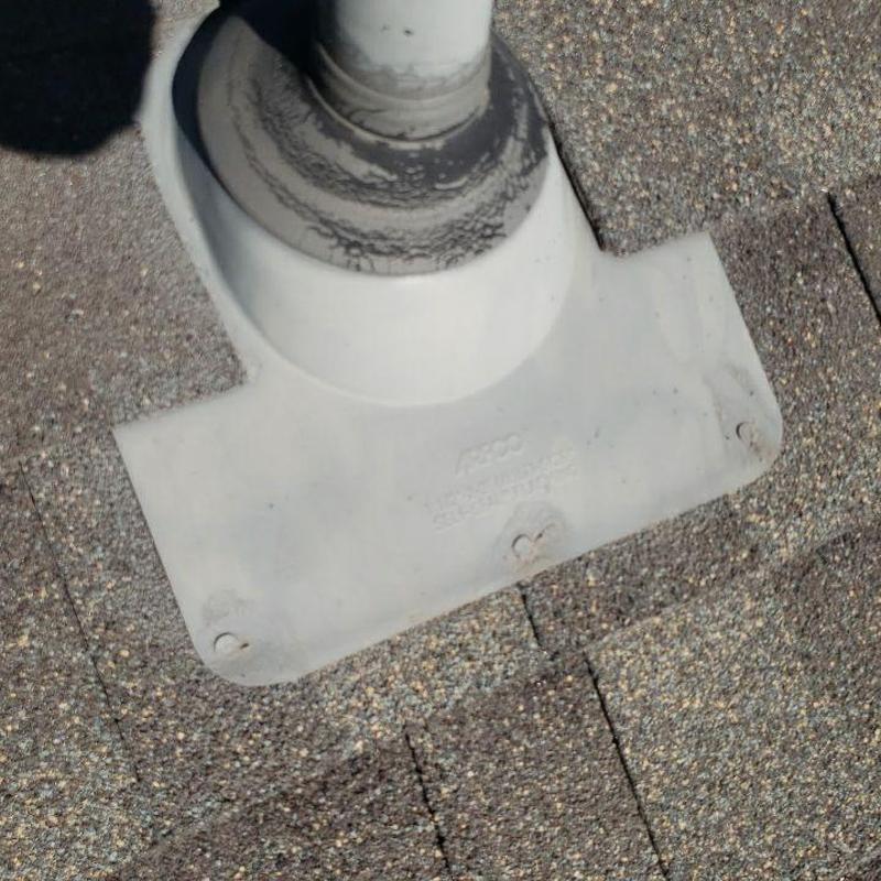 Pipe jack flashing on shingle roof with sealant Pipe jack flashing on shingle roof with sealant