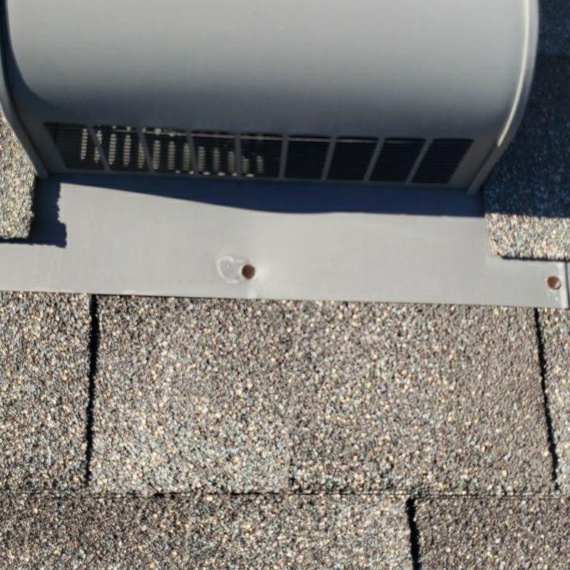 Shingle roof with metal vent flashing and sealed nails Shingle roof with metal vent flashing and sealed nails