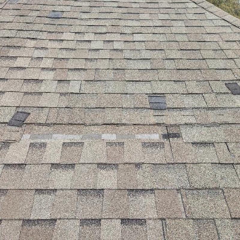 30-year asphalt shingles with missing and slipped areas