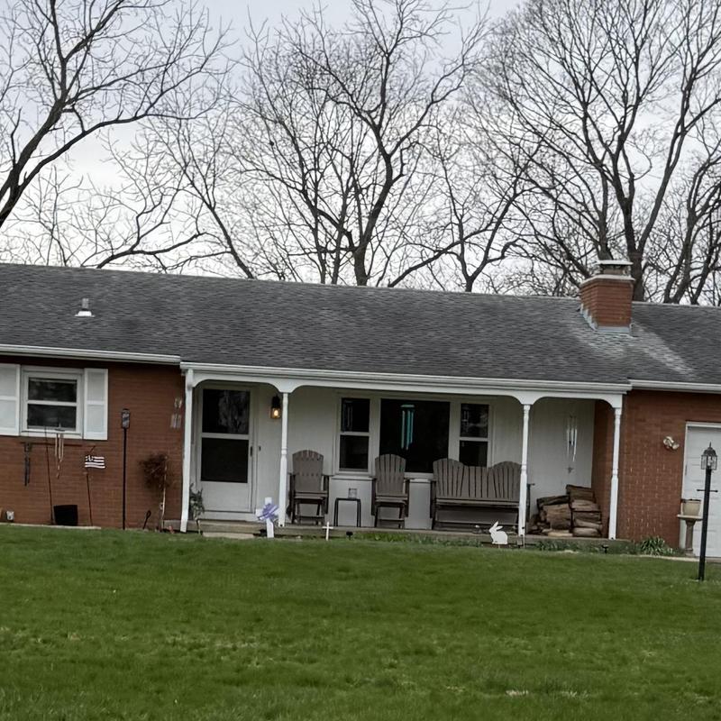 Asphalt shingle roof with chimney and porch seating Asphalt shingle roof with chimney and porch seating