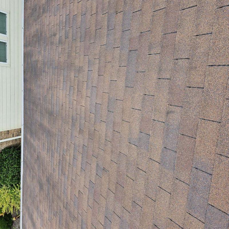 Golden Cedar roof shingles close-up on home exterior Golden Cedar roof shingles close-up on home exterior