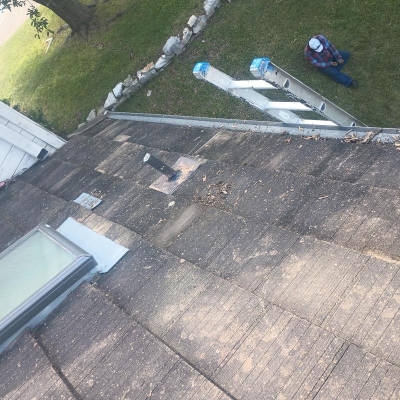 Concrete tile roof with vent pipe and skylight