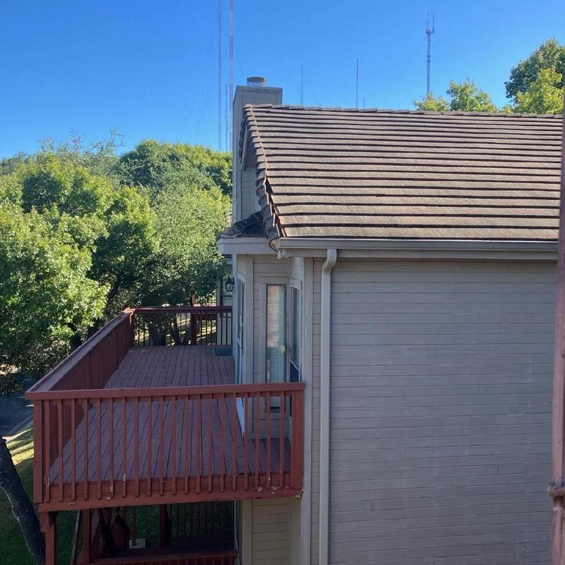 Concrete roof tile and fascia with deck railing