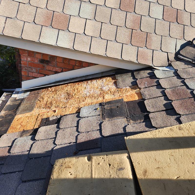 Designer shingles and roof decking replacement in progress