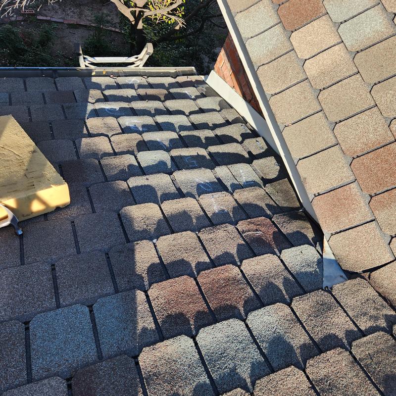Designer roof shingles with new synthetic underlayment installed