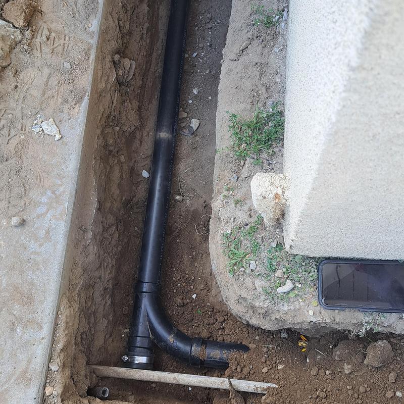 Two-way sewer cleanout and rerouted drain pipes