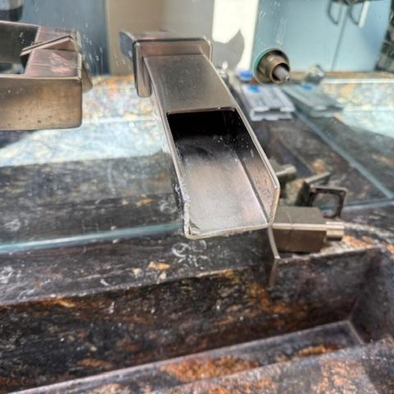 Wall-mounted bathroom faucet with detached handle