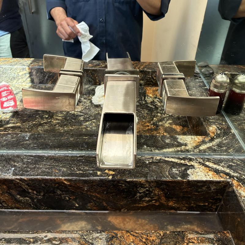 Wall-mounted bathroom faucet handle and drain service