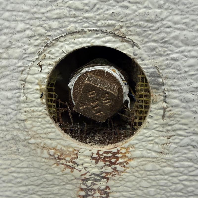 Drain line capped after urinal removal in commercial restroom