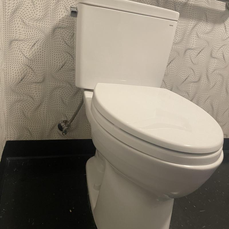 Toto Drake toilet installation with secure plumbing connection