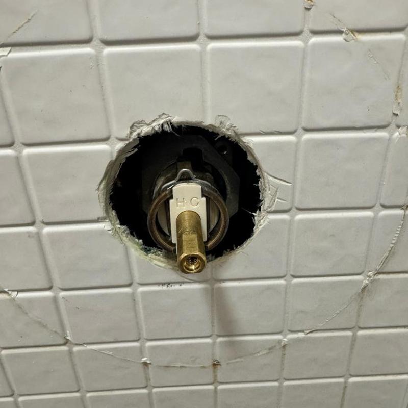 Shower cartridge and valve with tile wall opening