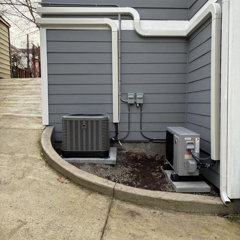Friedrich mini split and Ruud AC units outside house Friedrich mini split and Ruud AC units outside house