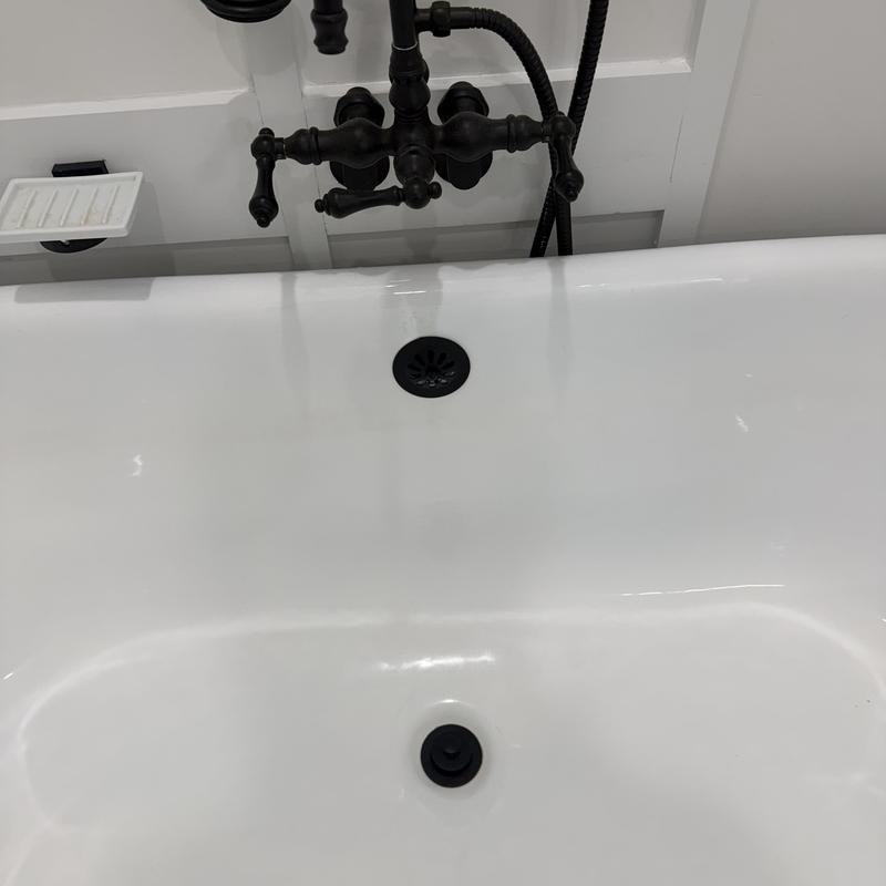 Matte black cast iron clawfoot tub and faucet installation