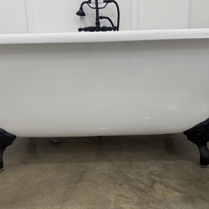 Matte black clawfoot tub with faucet installation
