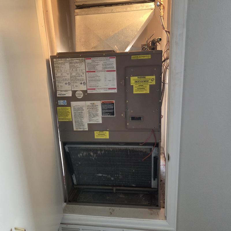 Gas furnace unit in wall cavity with wiring exposed
