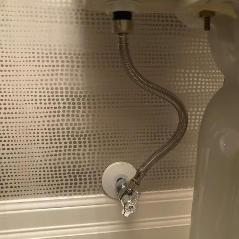 Angle stop valve with braided supply line under sink Angle stop valve with braided supply line under sink