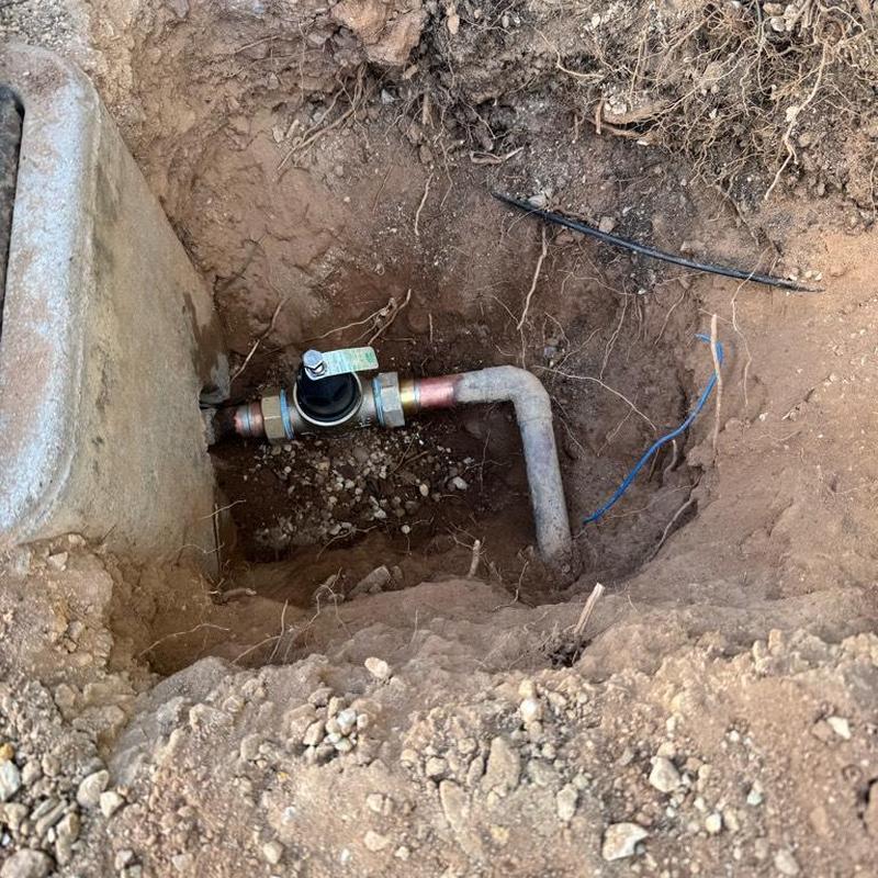 Pressure regulating valve on main water line in dirt