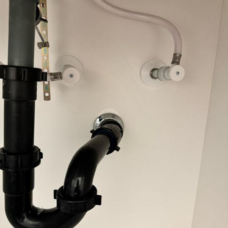 P-trap and water supply lines under sink installation P-trap and water supply lines under sink installation