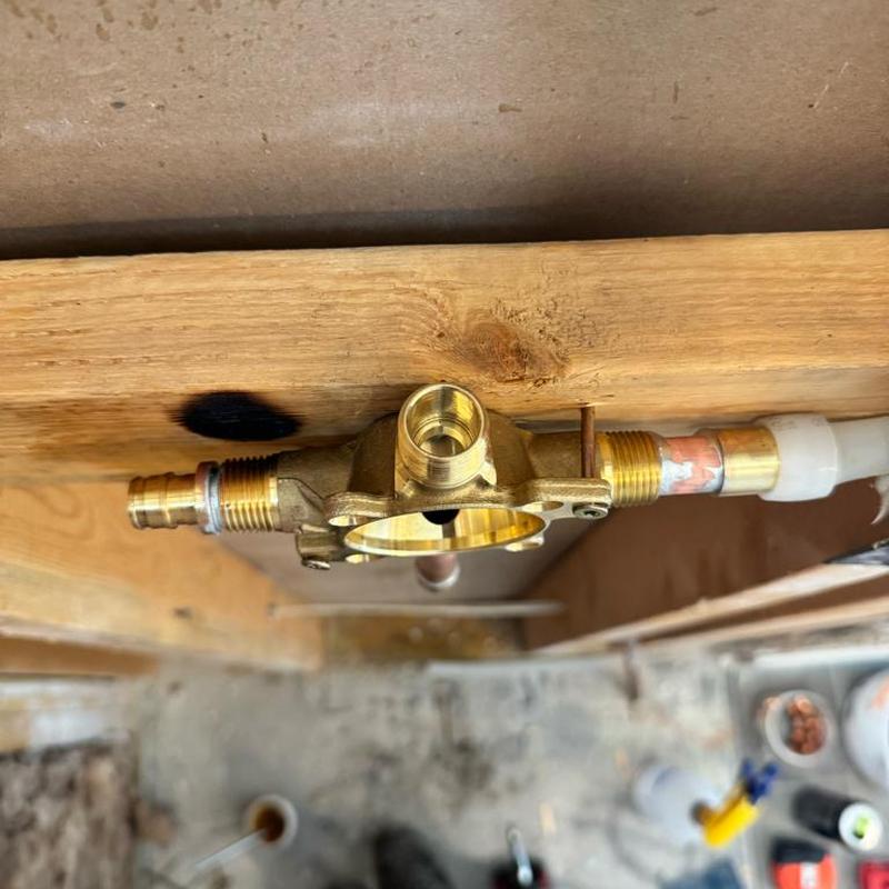 Kohler shower valve installation on wooden frame