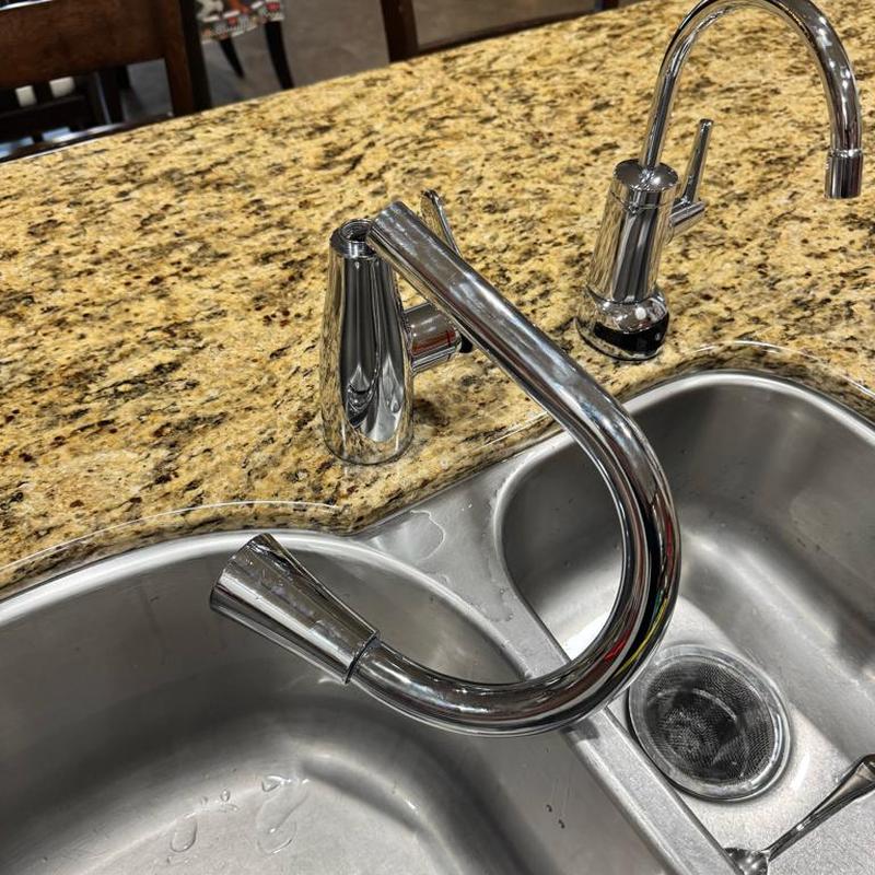 Kitchen faucet with detached spout on sink edge