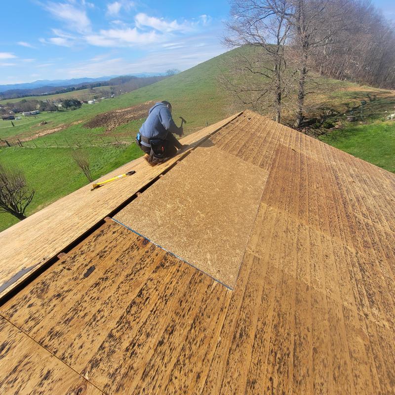 Roof decking replacement and repair on house roof