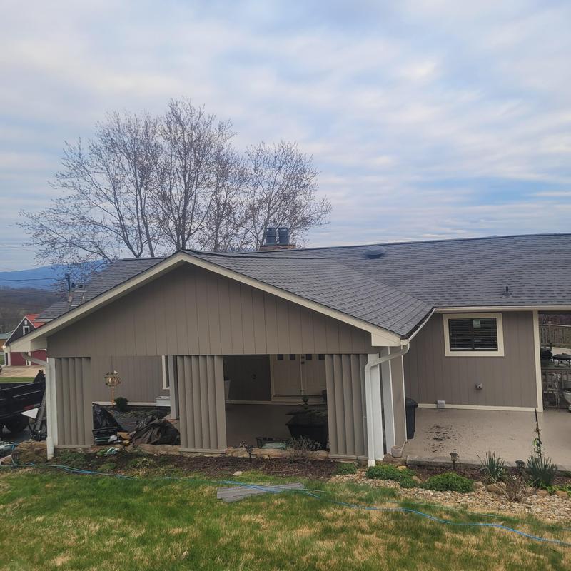 Atlas shingle roofing system on house after reroofing