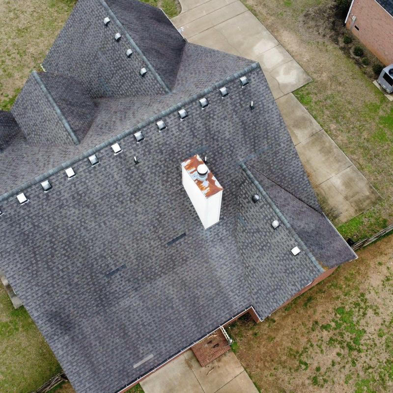Asphalt shingle roof storm damage inspection overhead