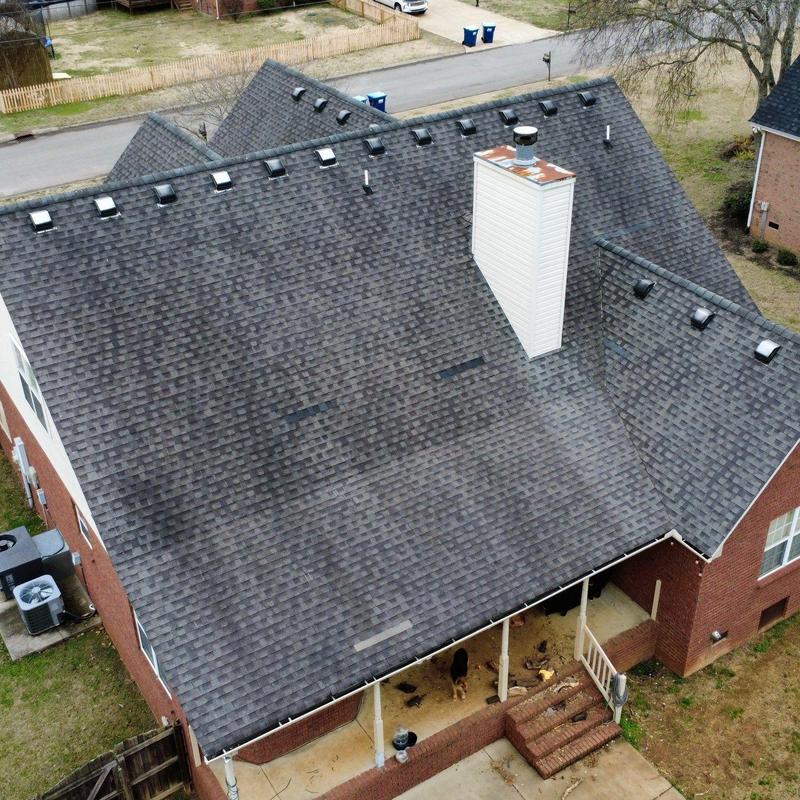 Asphalt shingle roof showing hail and wind damage