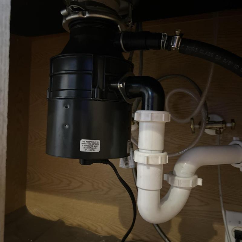 Garbage disposal and plumbing under sink installation