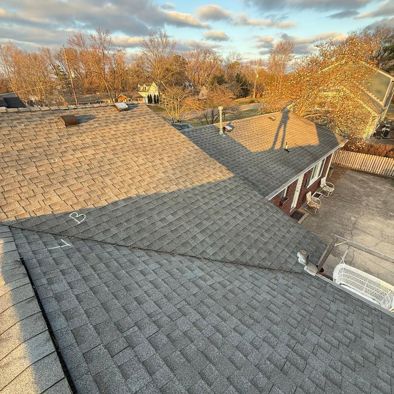 Asphalt shingle roof inspection markings on residential home