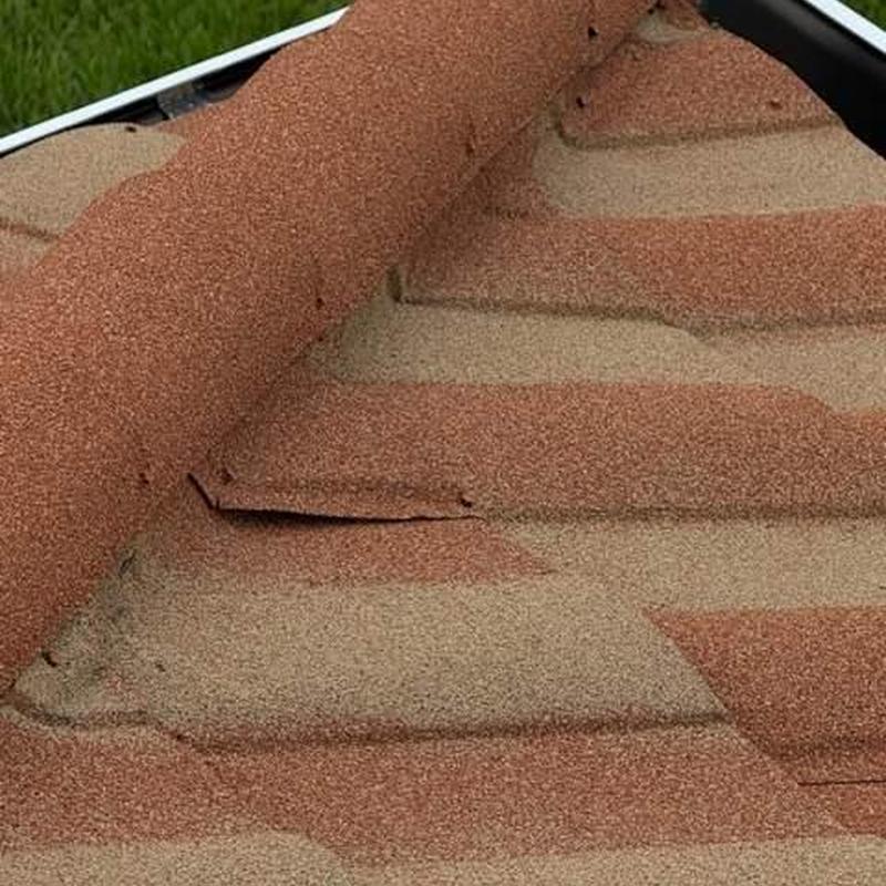 Stone-coated steel roofing with loose panel edges