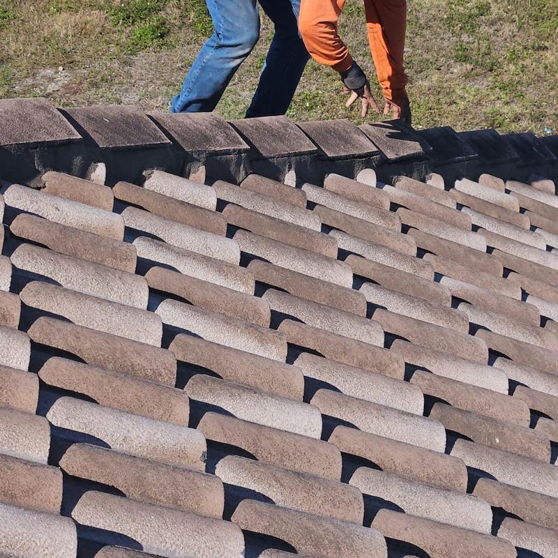 Concrete tile roof with inspecting workers in Cape Coral